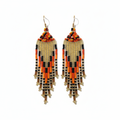 Boucles d'oreilles dorées fond blanc